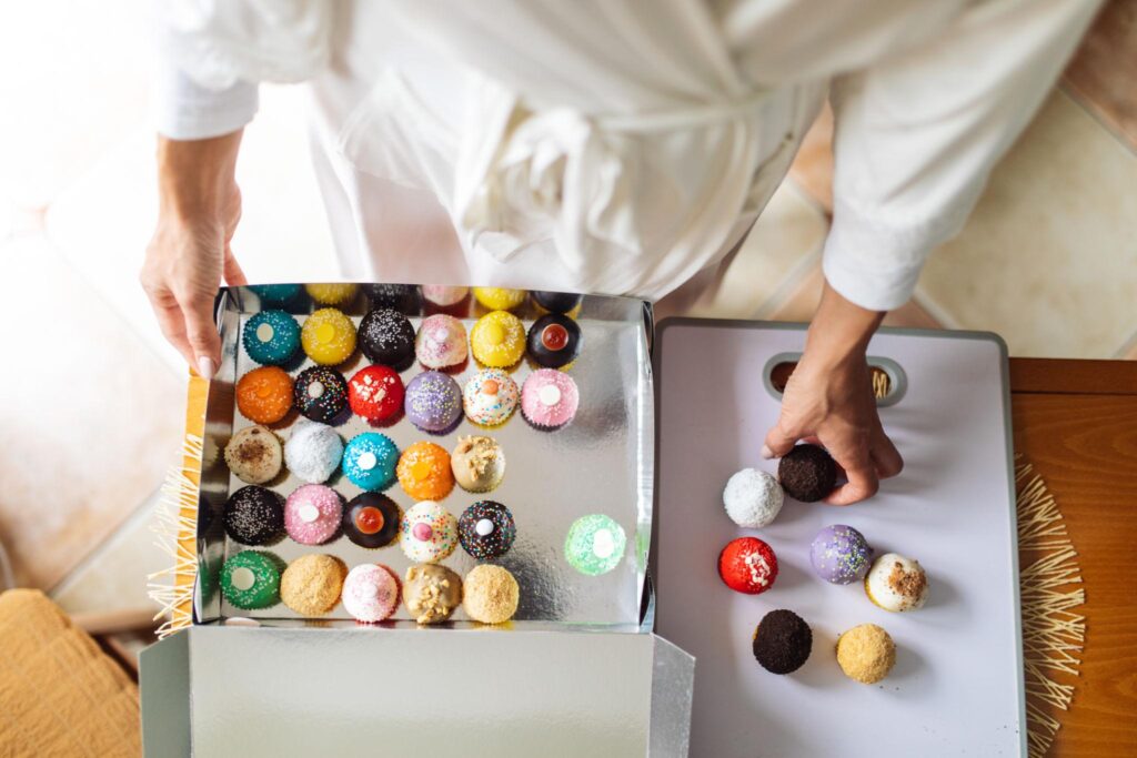 baking side hustle from home for moms preparing cupcakes desserts or meals in a kitchen showing how moms can start a food business from home and sell locally through social media side hustles from home for moms
