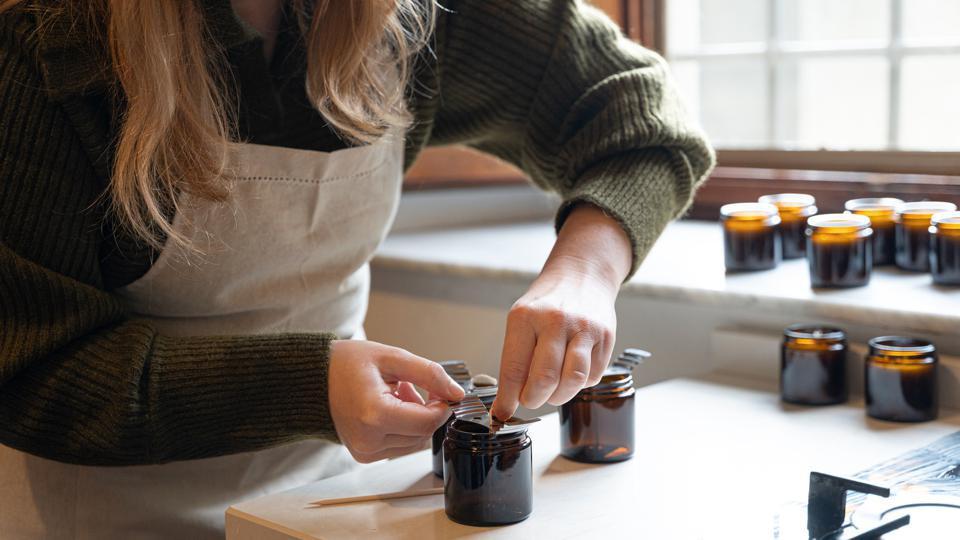 handmade crafts side hustle from home for moms creating jewelry candles or decorations in a home workspace showing how moms can turn creativity into income by selling handmade products online