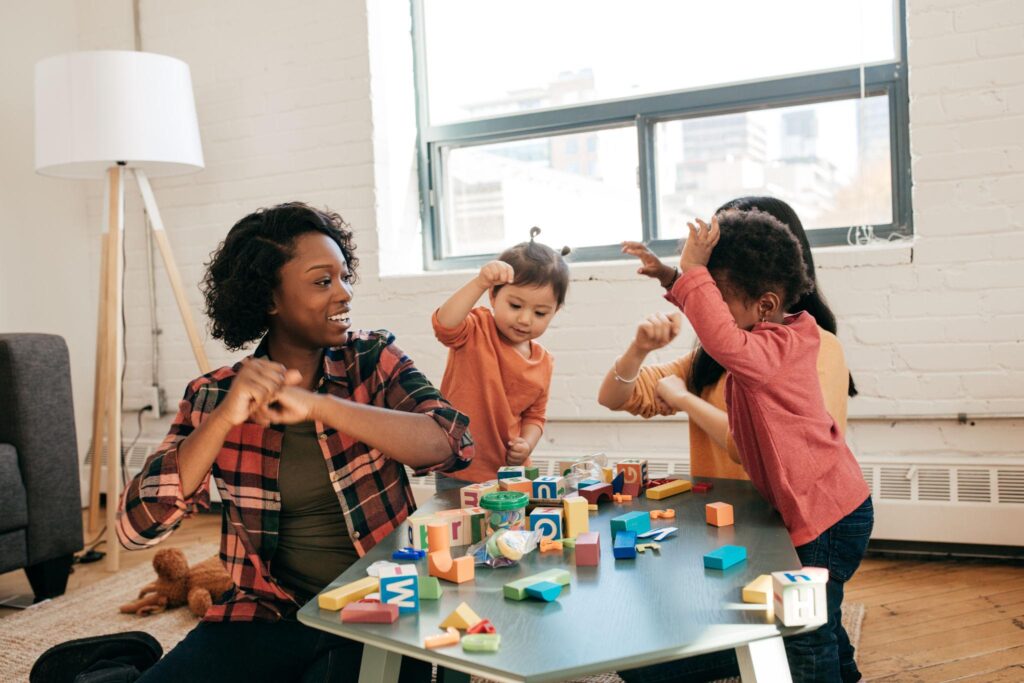 home daycare side hustle for moms caring for children in a safe home environment showing how moms can earn income while staying home and providing childcare services for other families