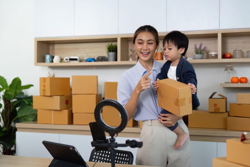 social media manager side hustle from home for moms managing content posting on platforms and growing accounts for businesses using a laptop and phone showing a flexible work from home income opportunity
