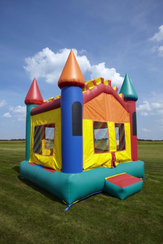 colorful bounce houses set up for kids party rental business