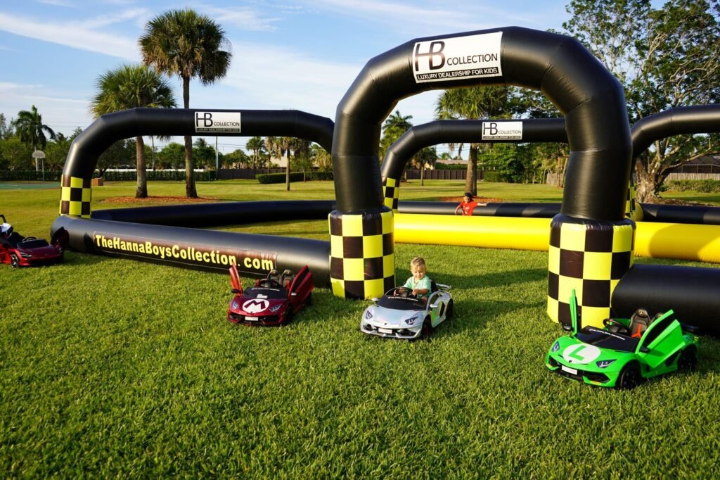 race car and sports themed bounce house inflatable rental setup for kids party